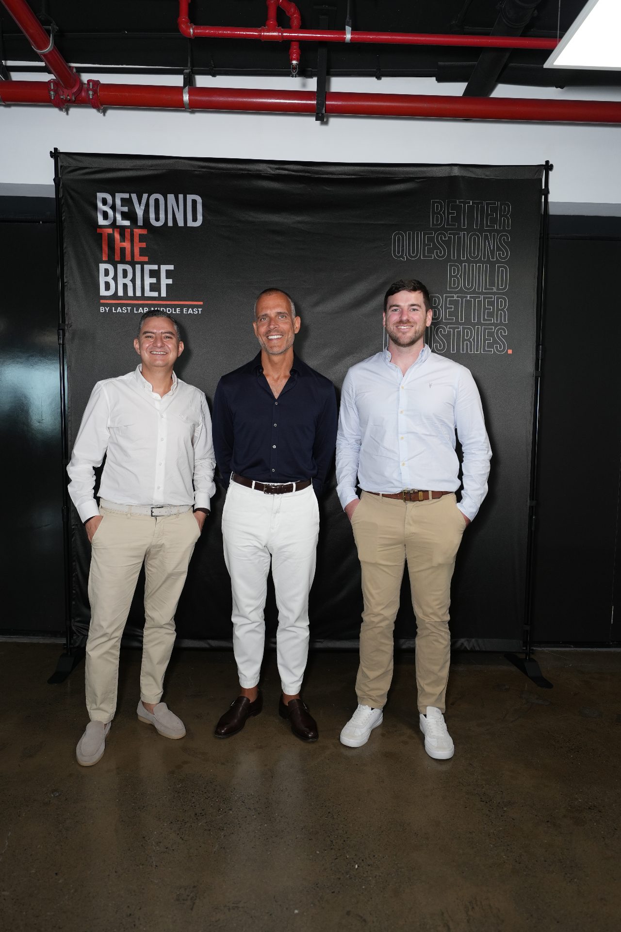 Attendees at the Beyond the Brief backdrop
