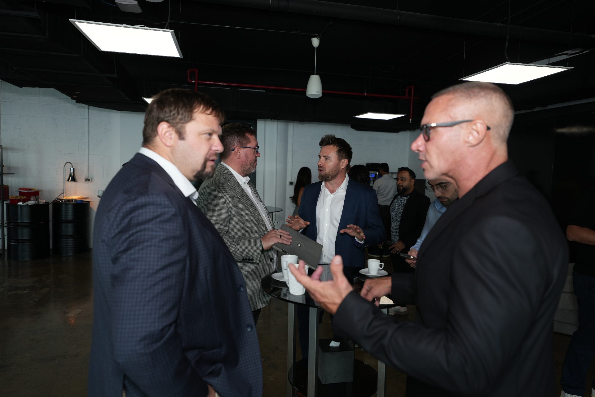 Attendees in conversation during the breakfast